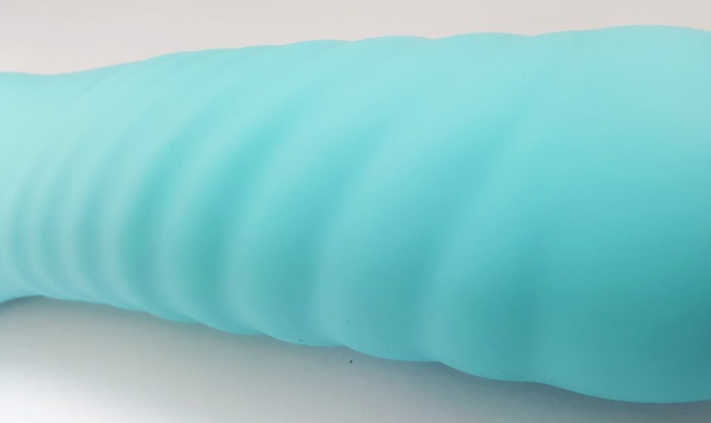 Close Up of the Shaft of the VeDO INU Super Plus Vibrator, Highlighting the Gently Rippled Texture.