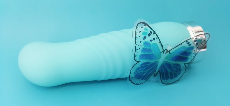 VeDO INU Super Plus Vibrator on Blue Background with Butterfly