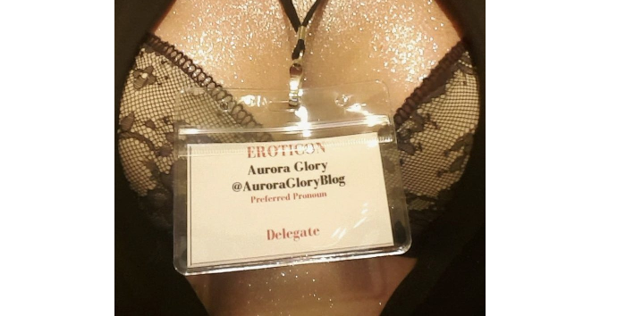 Photo of glittery cleavage, whilst wearing Eroticon 2018 badge