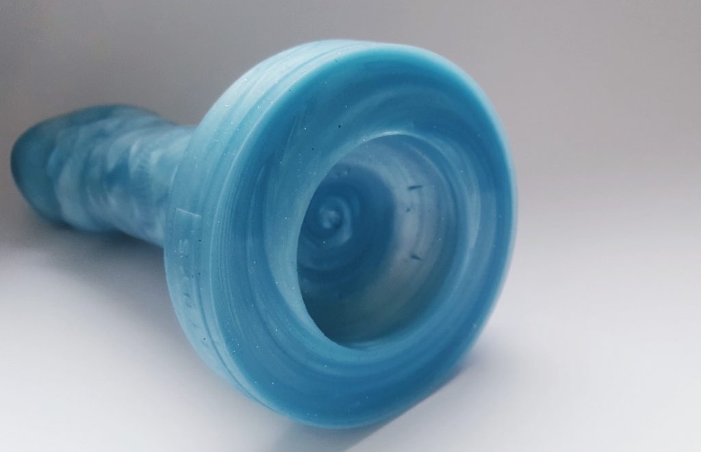 Photo of the suction cup base of the Vain Toys Stiffy. A chunky circular base.